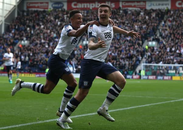 Jordan Hugill celebrates scoring PNE's second goal against Aston Villa with Callum Robinson