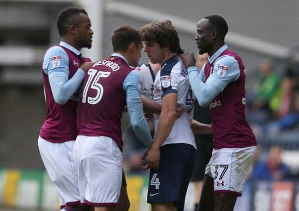 Ben Pearson and Aston Villa's Ashley Westwood square up at Deepdale on Saturday.