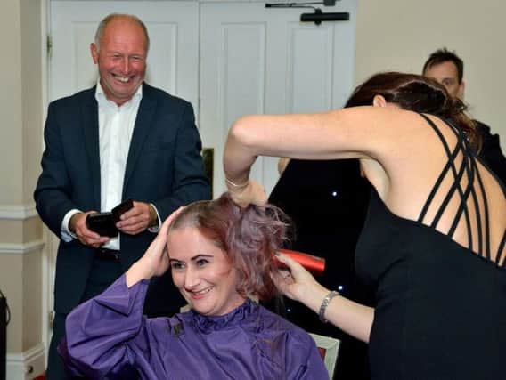 Genevieve Alty having her head shaved for Cancer Research UK