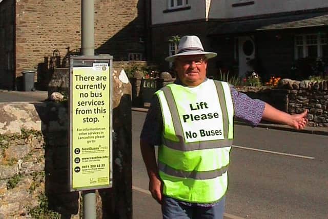 Hitch hiker: Duncan Foster thumbs a lift from the bus stop
