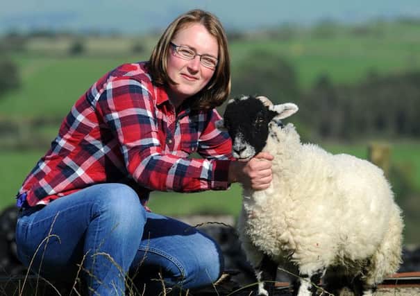 Staff nurse Lisa Huddleston, of Overhouses Farm near Wray, recently underwent a lifesaving heart operation and auctioned off a prize lamb from the farm to raise funds for Blackpool Victoria Hospital cardiac centre.
Lisa with another lamb from the farm.  PIC BY ROB LOCK
3-10-2016
