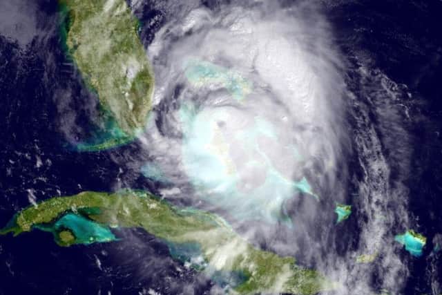 Satellite image provided by the National Oceanic and Atmospheric Administration (NOAA), shows Hurricane Matthew moving northwest of Cuba towards the Atlantic coast of southern Florida,