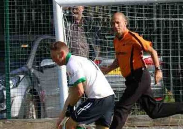 Ben Heywood (white shirt) in action for Preston against Leek