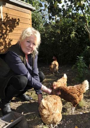 Mel Lawrenson tends her poultry