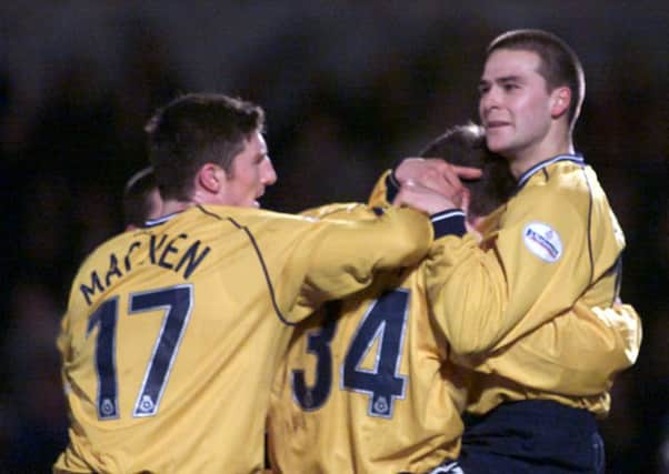 Eric Skora  (No 34) is congratulated by Jon Macken and David Healy after scoring against Brighton in January 2002