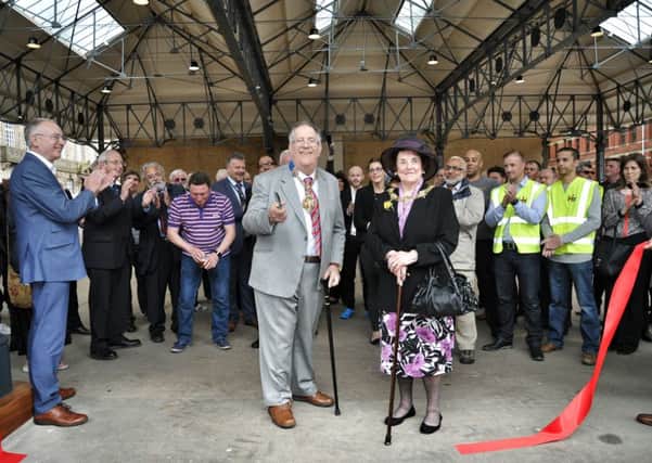 The current Mayor of Preston, Coun John Collins and Mayoress Mary Brade cut the ribbon to formally open the revamped Preston Fish market canopy