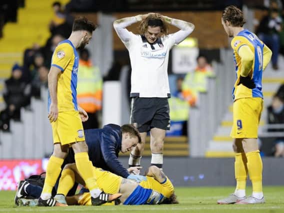 Stevie May lies on the ground against Fulham after suffering a serious knee injury