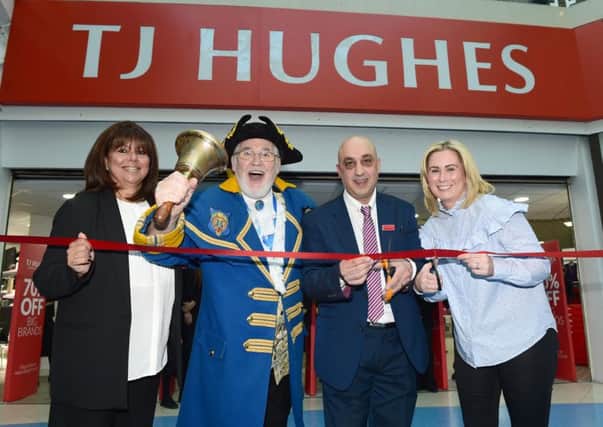 HR director Anna Gornall, Town Crier Peter Taunton, regional store manager Harry Panayi and regional merchandiser Kathryn Bloxsome  at the opening of TJ Hughes in Preston, five years after it left the Fishergate Shopping Centre