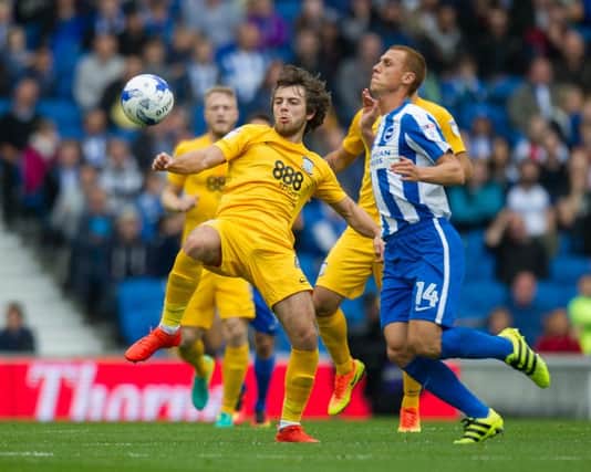 Preston North End's Ben Pearson battles for possession with Brighton & Hove Albion's Steve Sidwell
