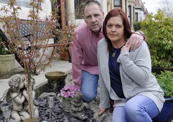 Julie and Larry Bayley in their garden