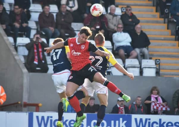 James Jennings battles for the ball against Stevenage.