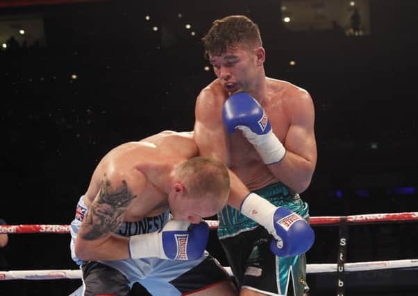 Boxer Scott Fitzgerald, right, improved his pro record to 5-0 by outpointing Adam Jones in Liverpool on Saturday ( PHOTO: Lawrence Lustig)