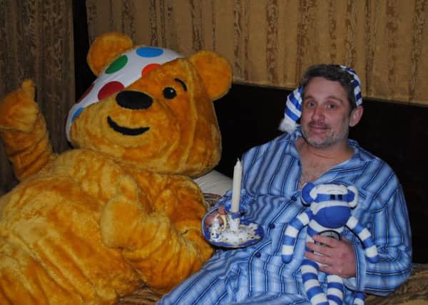 TIRED: Graham Liver with Pudsey before his mammoth charity challenge