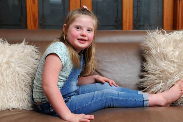 Hayley Carter with daughter Lola, six from Hoghton, who has Down's Syndrome - REAL LIFE STORY Lola was born with Down's Syndrome but loves going to mainstream school, playing with her friends, dancing and going to Rainbows. Her parents Hayley and Jason and brother Shaun aged 9, want people to know how rich a life with Down's Syndrome can be. Picture by Paul Heyes, Thursday October 13, 2016.