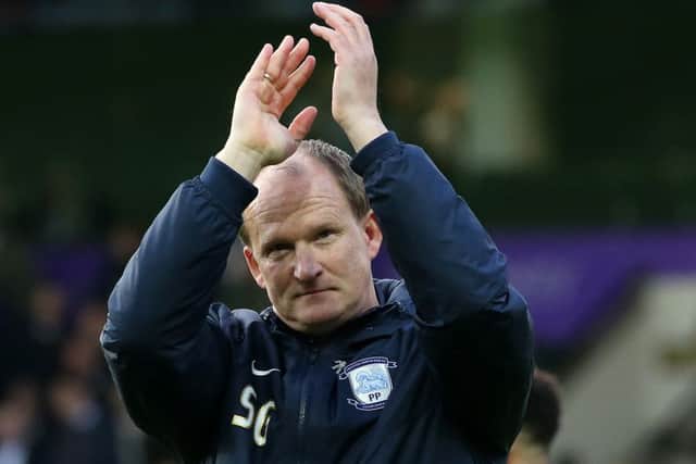 Simon Grayson applauds the PNE supporters at the final whistle at Norwich