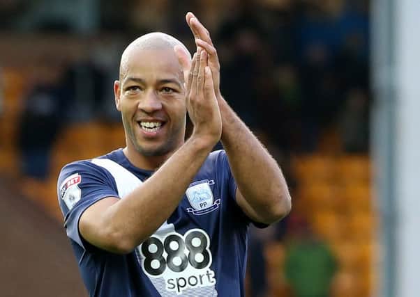 Alex Baptiste applauds the PNE fans after the win at Norwich