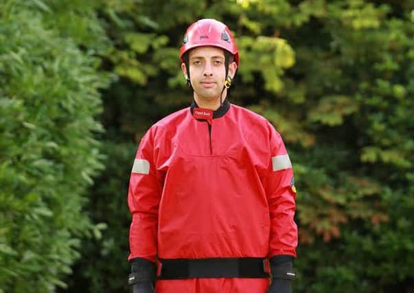 Special suit: A firefighter models one of the flood suits