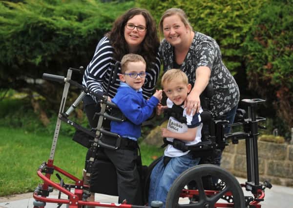 Photo Neil Cross
Thomas Hudson, five, and Luke Carter, eight, with mums Jo and Marie
