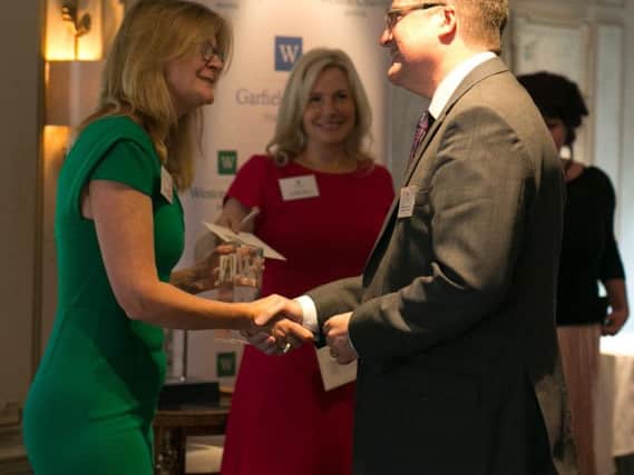 Stephen Hetherington, CEO of Methodist Action (North West) Ltd, receiving the charitys award from Kate Hobhouse, trustee of the Garfield Weston Foundation.