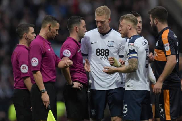 Preston North End's Tom Clarke remonstrates with referee Christopher Kavanagh at the end of the match, watched on by Preston North End's Simon Makienok (centre)