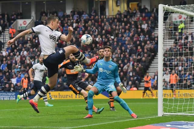 Newcastle United's Karl Darlow watches as Preston North End's Jordan Hugill jumps high to meet the ball