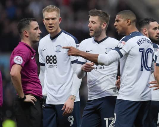 Preston North End's Jermaine Beckford, Paul Gallagher and Simon Makienok remonstrate with referee Christopher Kavanagh after his failure to award a penalty