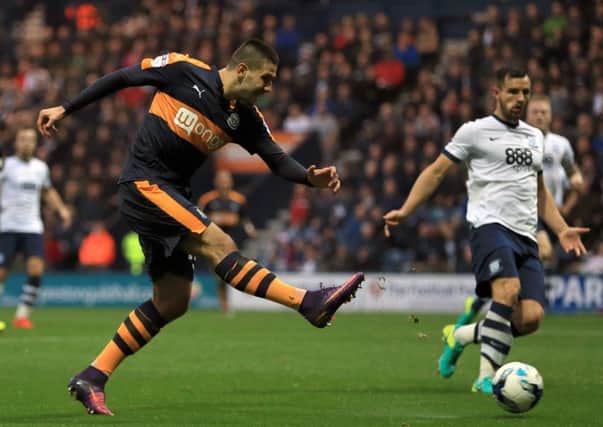 Newcastle United's Aleksander Mitrovic scores his sides first goal during the Sky Bet Championship match at Deepdale