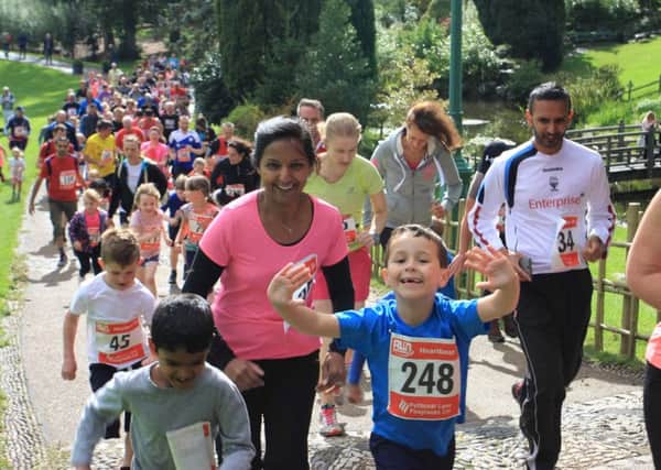 runners climbing the hill of Avenham Park during the annual Heartbeat 2Km run