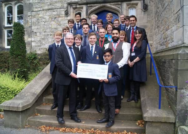 pupils from LRGS presenting their cheque to the chosen charities