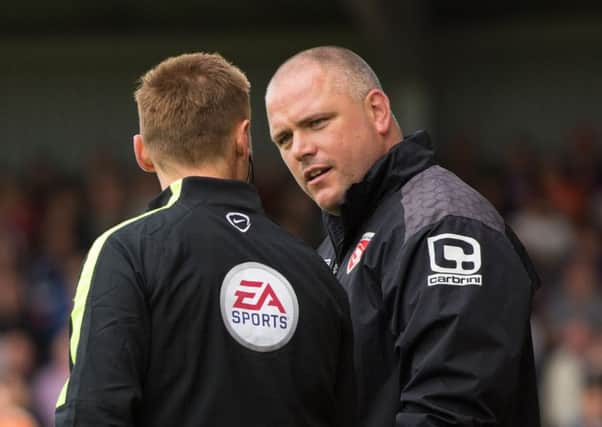 Jim Bentley (right) will not accept what is happening on the pitch