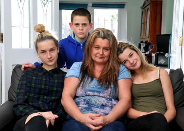 Andrea Flynn and her children Robyn, Rebecca and Ciaron at home after a holiday in Turkey where they were all ill
