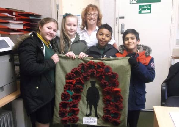 Brockholes Wood Community School pay tribute to  World War One soldiers with their new art work