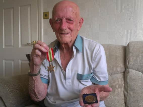 James Morley with his Anzio Beachhead Commemorative Medal and the Italy war medal