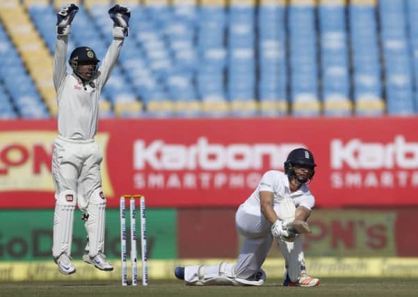 Indian wicketkeeper Wriddhiman Saha left, appeals for the wicket of England's batsman Zafar Ansari