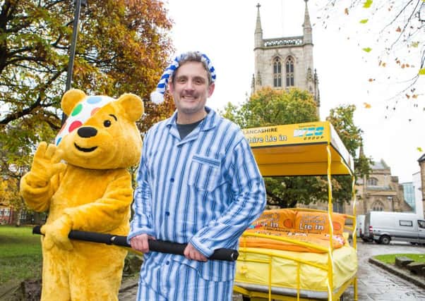 Graham Liver with Pudsey Bear at the Children in Need bed pull launch
