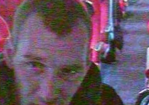 CCTV image of a man BTP want to speak to in connection with the theft of a bag from a train
