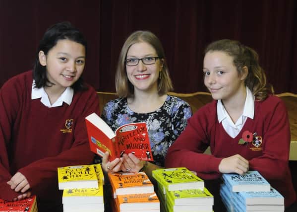Author Robin Stevens gives a talk to schoolchildren at Penwortham Girls High.  She is pictured with Ashleigh Stansfield and Darcy Smith.