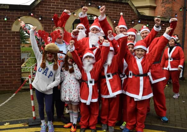 Festive fun: Supporters at last years Santa Dash