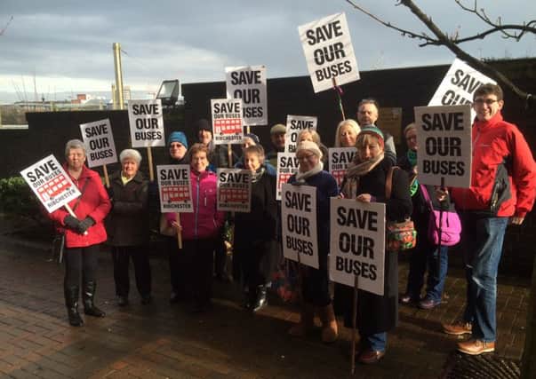 Bus protesters outside County Hall, Preston, ahead of a budget meeting