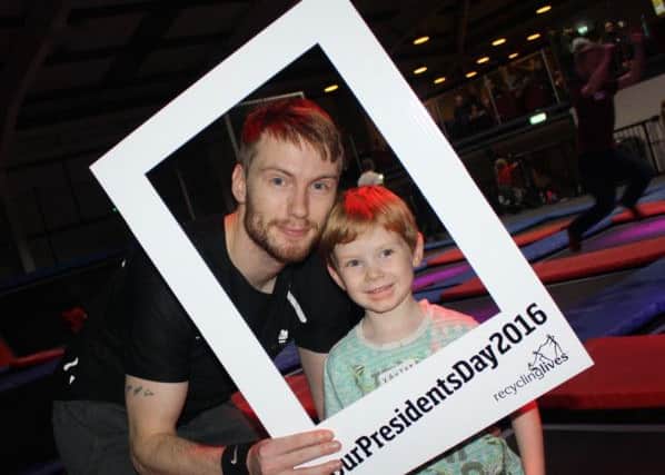 Recycling Lives employee Adam Smith with his son Xavier at Energi trampoline park for Presidents Day