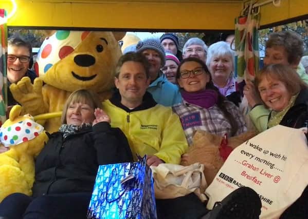 BBC Radio Lancashire presenter Graham Liver with the crowd in Happy Mount Park in Morecambe, shortly after his bed pull for Children In Need.
