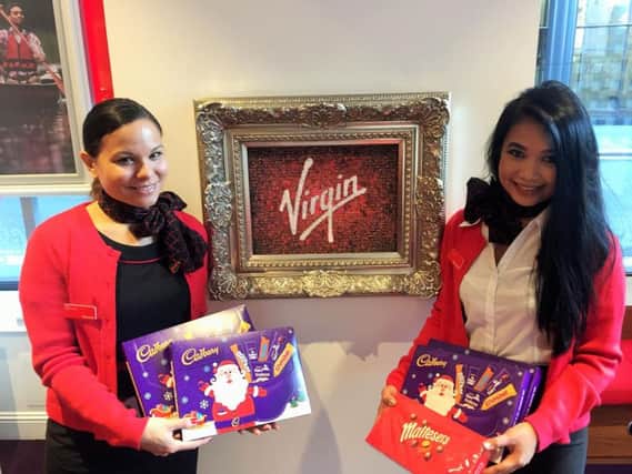 Virgin Money store colleagues with some of the donated Christmas items