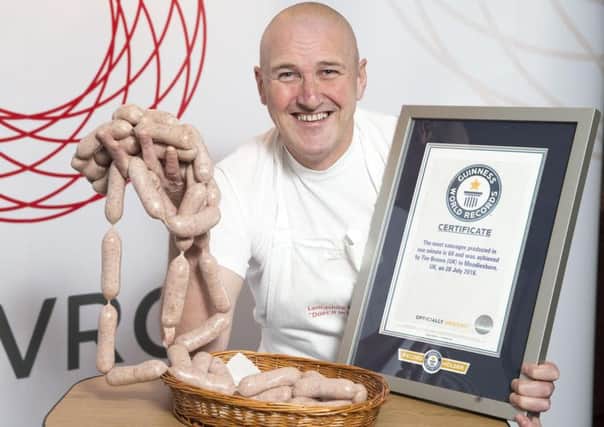 Chorley butcher Tim Brown has been awarded his certificate after his world record for the most number of sausages made in a minute was verified by Guinness