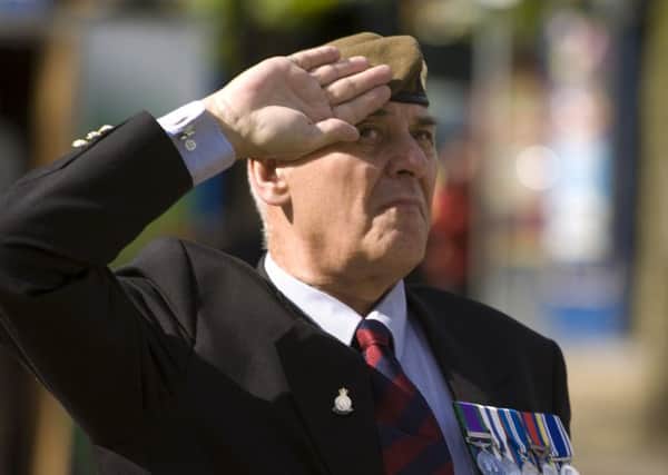 Photo : Coun Davies at an Armed Forces Day flag ceremony at the Cenotaph in Preston