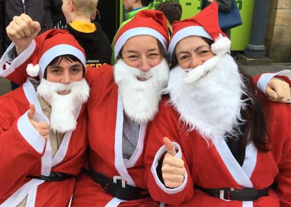 From left, Debbie Speight, 41 from Morecambe, Carol Williamson, 44 from Garstang and Helen Harling, 43 from Lancaster after CancerCare's Santa Dash.