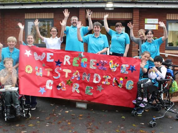 Staff and children at Derian House celebrates its outstanding care result