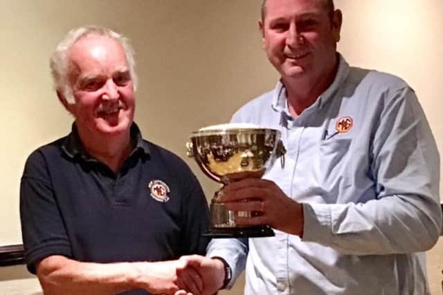 West Lancs MG Owners Club member Steve Kirton being presented the Dargan Trophy by Cam Cunningham (secretary and last year's winner)