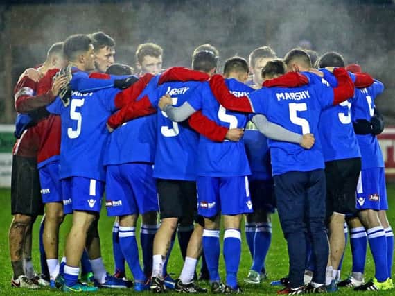 The Lancaster City players gather before kick-off on an emotional night at Giant Axe. Picture: Tony North