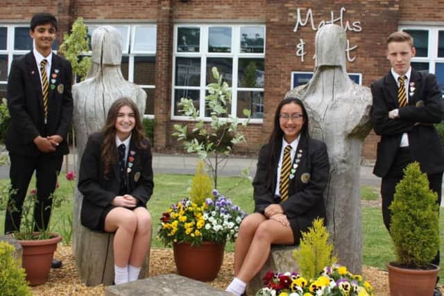 Penwortham Priory Academy pupils in the school's garden after it won the Royal Horticultural Societys Britain in Bloom North West Environmental Award for Schools.