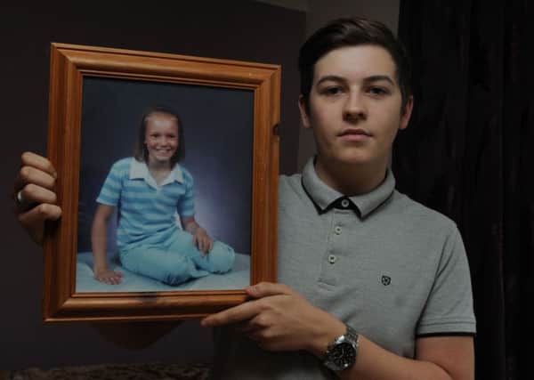 Gary Rae: Jack Goodison, 17, holds a photograph of his sister Rebecca